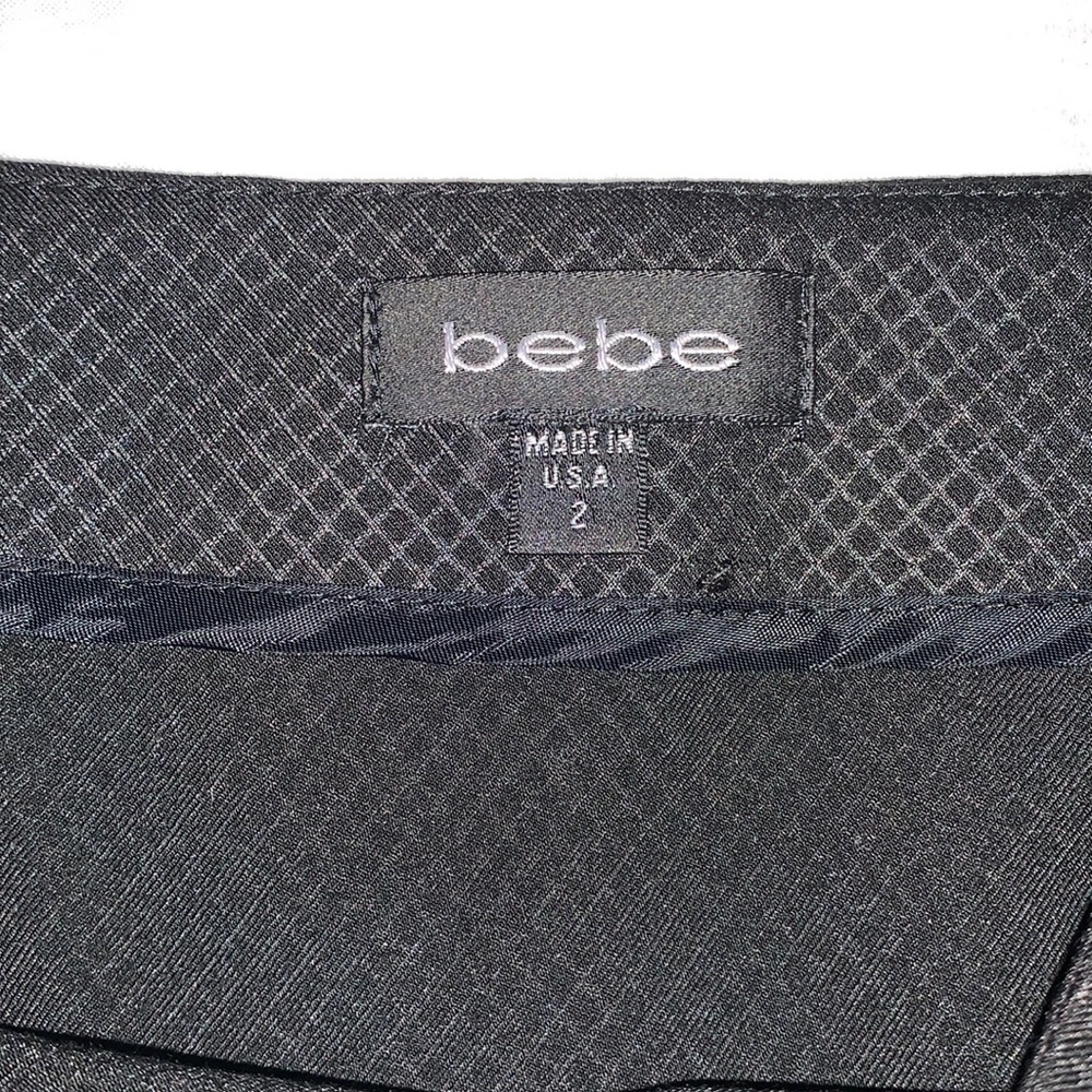 BeBe Skirt, Size 2. Good used condition. Pleaded on the sides. Runs big - Picture 2 of 6